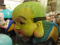 giant green head doll 