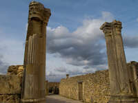 view--volubilis roman columns under cloudy sky Meknes, Moulay Idriss, Imperial City, Morocco, Africa